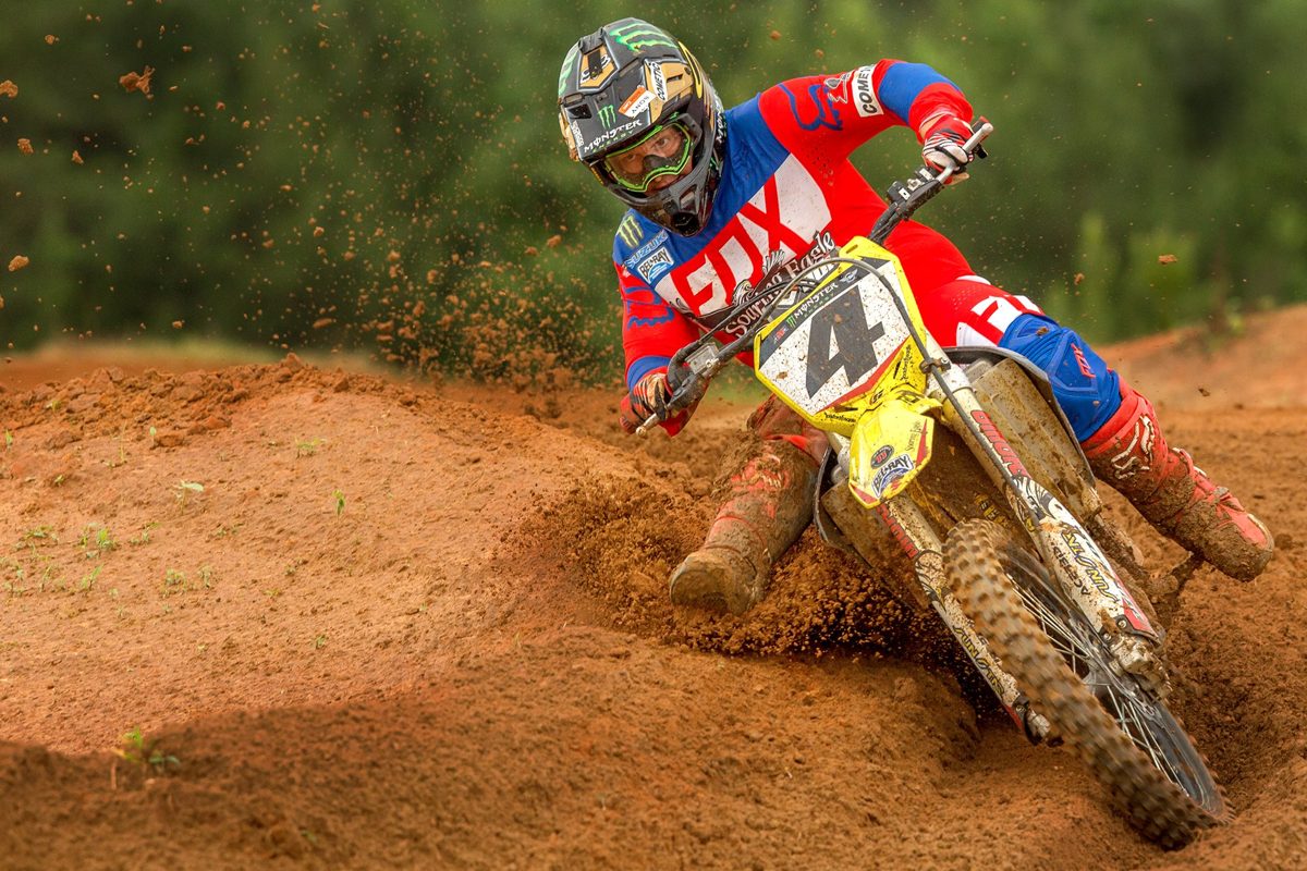 Motocross rider cornering on a dirt track